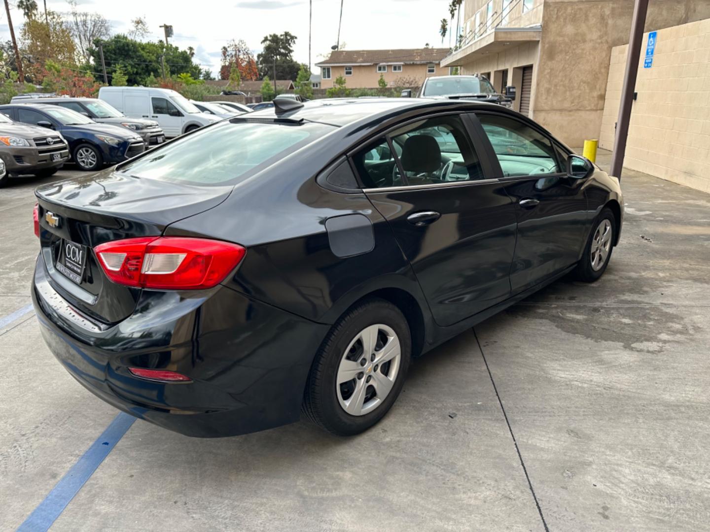 2017 Black /BLACK Chevrolet Cruze LS Auto (1G1BC5SM6H7) with an 1.4L L4 DOHC 16V TURBO engine, 6A transmission, located at 30 S. Berkeley Avenue, Pasadena, CA, 91107, (626) 248-7567, 34.145447, -118.109398 - Crown City Motors is a used “Buy Here Pay Here” car dealer in Pasadena CA. “Buy Here Pay Here” financing, means that when you purchase your vehicle from our dealership, that you make the payments to the dealership as well. We do not need the banks approval to get you approved for a used auto - Photo#4